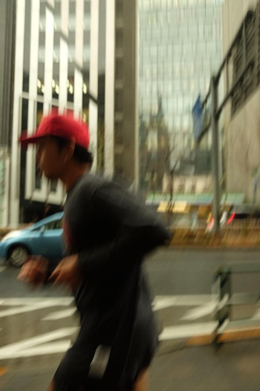 Runner passing city buildings